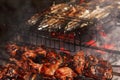 Fried juicy bbq meat and fish in a grill on a fire cooking food on a bonfire Royalty Free Stock Photo