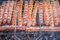 Fried barbecue sausages on grill