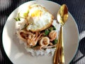 Fried basil leave with (pork, squid, shrim, chicken ) with fried egg .