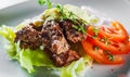 Fried beef piece fillet with vegetables salad