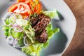 Fried beef piece fillet with vegetables salad