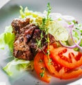 Fried beef piece fillet with vegetables salad