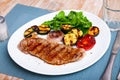 Fried beef steak with grilled vegetables and fresh corn salad Royalty Free Stock Photo