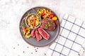Fried beef steak with peach fruit salsa, tomato and chili