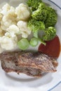 Fried beef tomato ketchup and green Broccoli white flowering ca Royalty Free Stock Photo