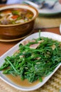 Fried bitter gourd leaf with oyster sauce