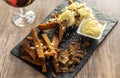 Fried black rye bread toasts with cheese salt and spices, on a plate