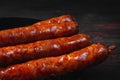 Fried bratwurst. Grilled sausages. BBQ sausages on a plate Royalty Free Stock Photo