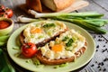 Fried bread with eggs, cheese and onion