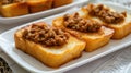 Fried Bread with Minced Pork Spread in a white plate placed on the table Royalty Free Stock Photo