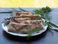 Delicious fried rolls with herbs.