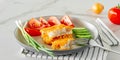 Fried breaded fish fillets withcucumper ant tomatoes served on a plate close up Royalty Free Stock Photo