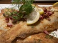 fried and breaded plaice with bacon