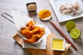 Fried breaded squid and curry sauce and lime Royalty Free Stock Photo
