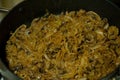 Fried cabbage with mushrooms in a pan Royalty Free Stock Photo