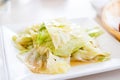 Fried cabbage with Shell oil on white plate,Thai food style