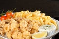 Fried calamari and pommes frittes Royalty Free Stock Photo