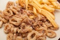 Fried calamari rings with fries