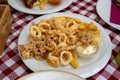 fried calamari squid fresh catch in Croatia Rovinj with garlic sauce and fries fast seafood