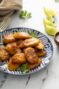 Fried caramelized plantains served with lime wedges Royalty Free Stock Photo