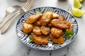 Fried caramelized plantains served with lime wedges Royalty Free Stock Photo