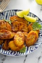 Fried caramelized plantains served with lime wedges Royalty Free Stock Photo