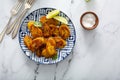 Fried caramelized plantains served with lime wedges Royalty Free Stock Photo