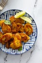 Fried caramelized plantains served with lime wedges Royalty Free Stock Photo