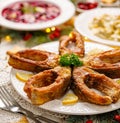 Fried carp fish slices on a white plate, close up. Traditional christmas eve dish. Royalty Free Stock Photo