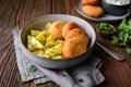 Fried cauliflower and cheese croquettes with boiled potatoes and sour cream dip