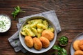 Fried cauliflower and cheese croquettes with boiled potatoes and sour cream dip