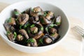 Fried champignons with garlic and parsley in a gray bowl. Vegetarian lifestyle concept. Horizontal orientation. Royalty Free Stock Photo