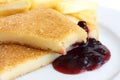 Fried cheese, cut and melting with cranberry sauce