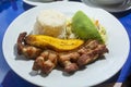Fried chicharron with banana, traditional Colombian food