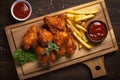 Fried chicken breaded wings with french fries. Generative AI illustration Royalty Free Stock Photo