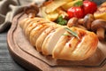 Fried chicken breast served with garnish on wooden board Royalty Free Stock Photo