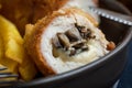 Fried chicken breast stuffed with mushrooms and cheese wrapped i Royalty Free Stock Photo