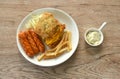 fried chicken cheese steak with salad and pork sausage couple French Fries on plate dipping Mayonnaise sauce Royalty Free Stock Photo