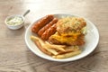 fried chicken cheese steak with salad and pork sausage couple French Fries on plate dipping Mayonnaise sauce Royalty Free Stock Photo