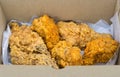 Close-up of fried chickens in cardboard box. Royalty Free Stock Photo