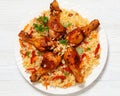 fried chicken drumsticks over rice pilaf, top view Royalty Free Stock Photo