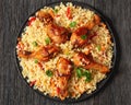 fried chicken drumsticks over rice pilaf, top view Royalty Free Stock Photo