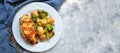 Fried chicken fillet. Broccoli and cauliflower. Baked chicken breast. Chicken and tomato. Food in a white plate on a Royalty Free Stock Photo