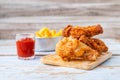 Fried chicken food and french fries on a wooden table Royalty Free Stock Photo