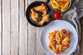 Fried chicken food and french fries on a wooden table Royalty Free Stock Photo