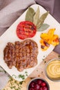 Fried chicken with grilled tomatoes, Ukrainian cuisine. Photo of food on a white background Royalty Free Stock Photo