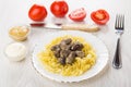 Fried chicken hearts and pasta, bowls with mustard, mayonnaise,