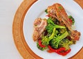 Fried chicken leg with fusilli pasta, broccoli and vegetables
