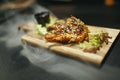 Fried chicken legs with teriyaki sauce sesame seeds and rice on black stone. Close up. Black background Royalty Free Stock Photo