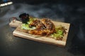 Fried chicken legs with teriyaki sauce sesame seeds and rice on black stone. Close up. Black background Royalty Free Stock Photo